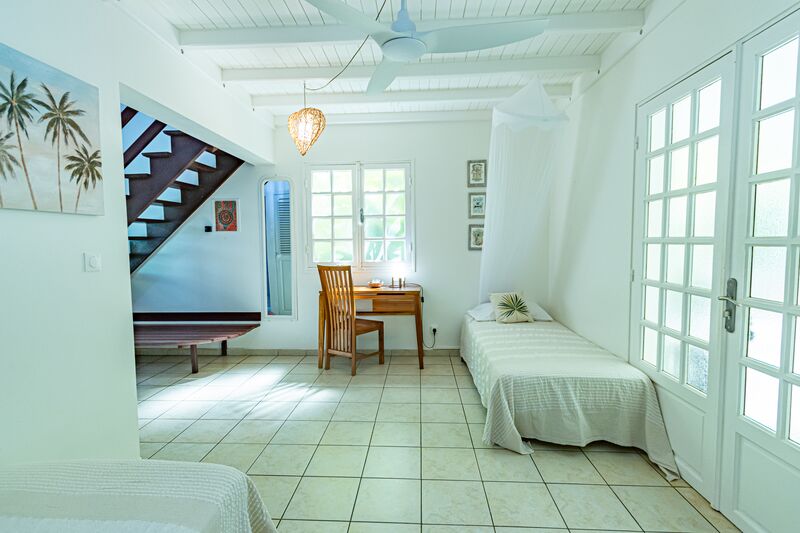 Un lit au Caraïb'Bay Hôtel